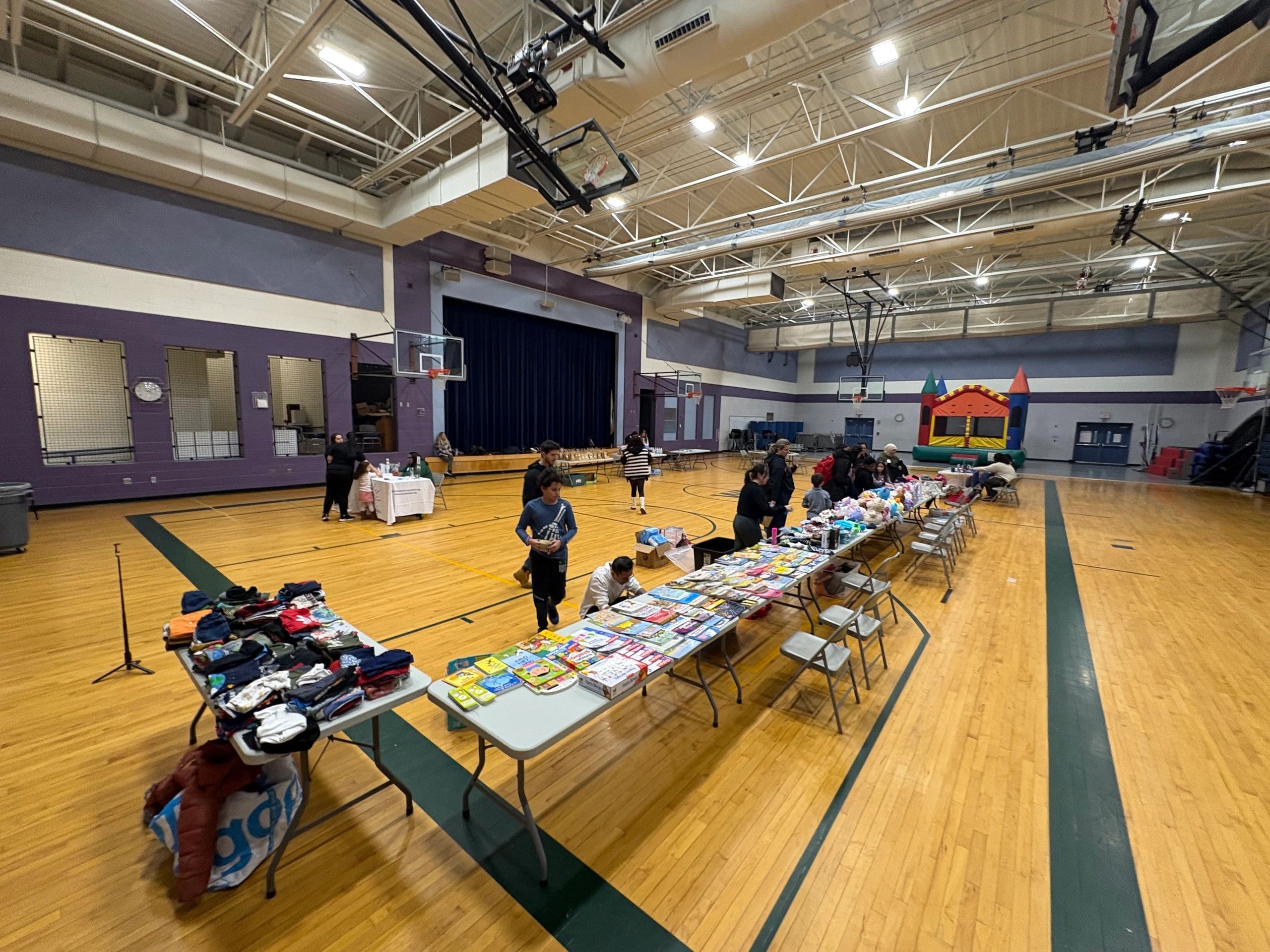 Volunteers handing supplies to children